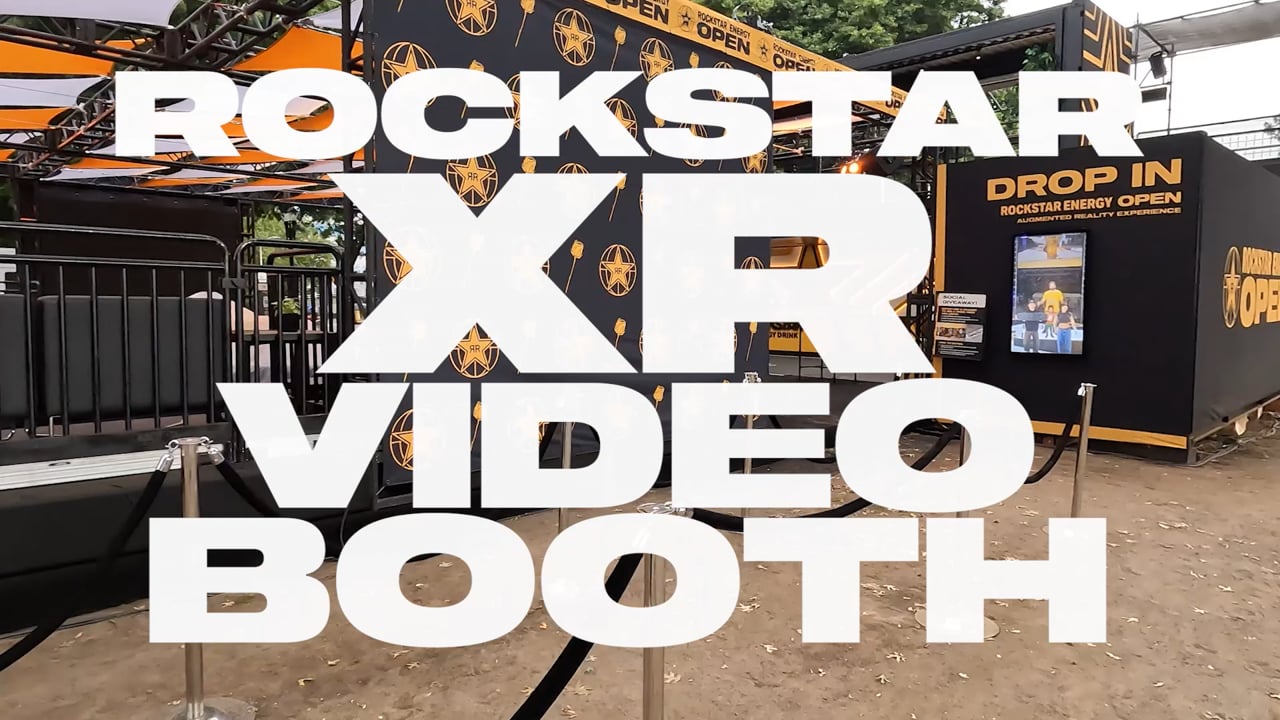 Rockstar XR video booth film title over the shipping-container installation.