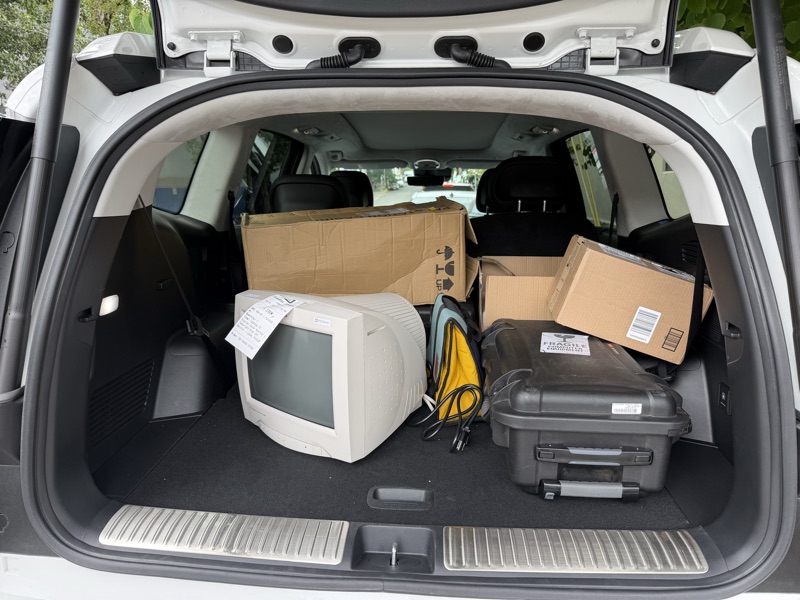 The sourced CRT monitor packed in the back of a vehicle with production equipment.